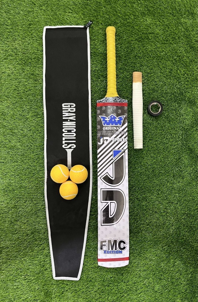 Crickets bat, ball, and Bat bag on a green grass background