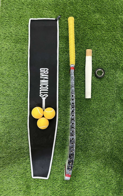 Jd Cricket bat  balls, and a Cricket bat Handle grip  on a green grass background